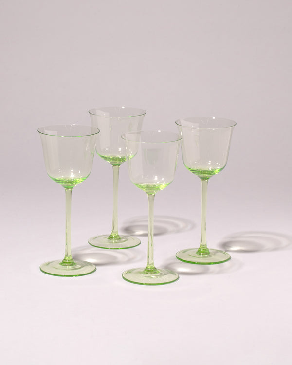 Serax Collection glassware in transluscent green, on a neutral-light background.