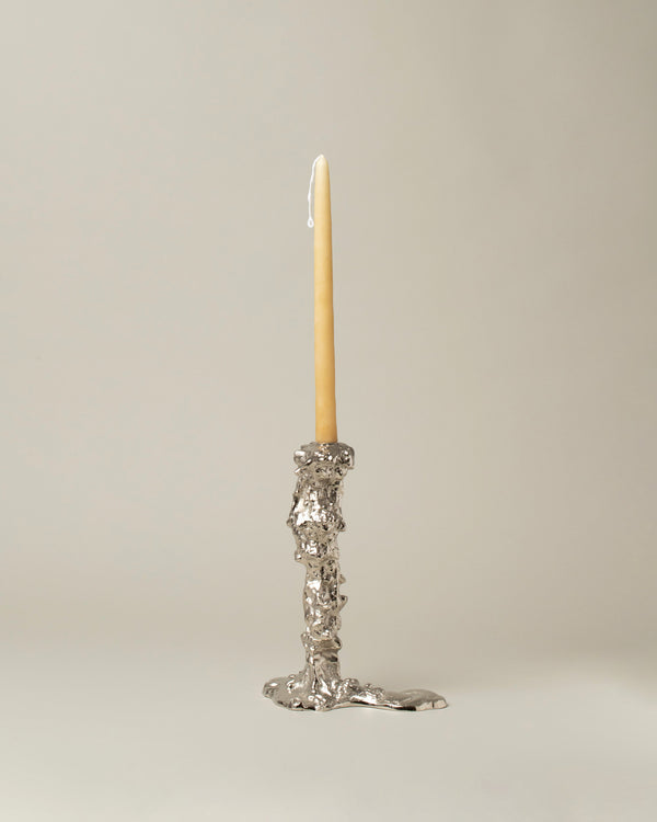 POLSPOTTEN Collection candlestick with silver treatment on a neutral-light background.
