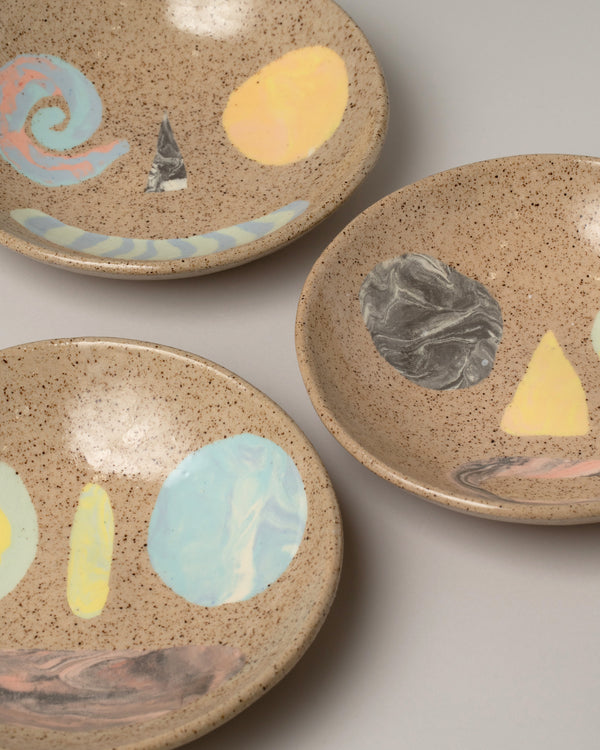 E.E. Ceramics Collection Smiley ceramic bowls on a neutral-light background.