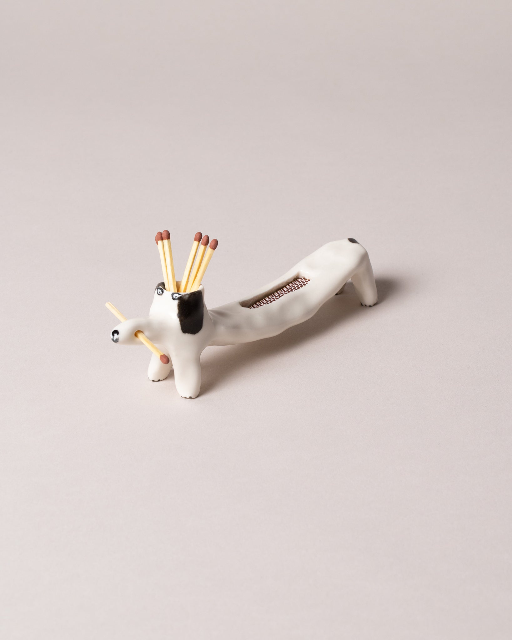 Eleonor Boström Collection ceramic Matchstick Dog on a neutral-light background.