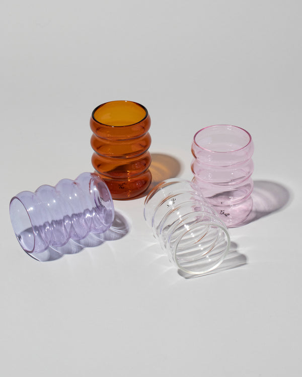 Sophie Lou Jacobsen Collection Ripple Cups in ochre, lilac, pink and clear, on a neutral-light background.