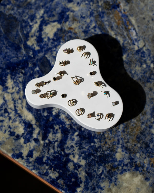 Mociun Stud Earrings on marble counter.