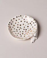 Closeup details of the Eleonor Boström Dots Mini Dog Dish on light color background.
