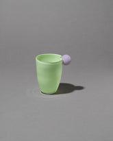 Helle Mardahl Lavender & Pear Bon Bon Water Glass on grey color background.