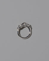 View from the side of the CRZM Sterling Silver Ophiolite Ring on light color background.