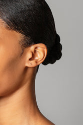 Star Stud Earring Single on model.