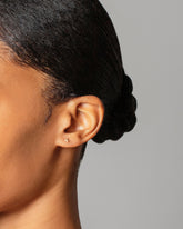 Star Stud Earring Single on model.