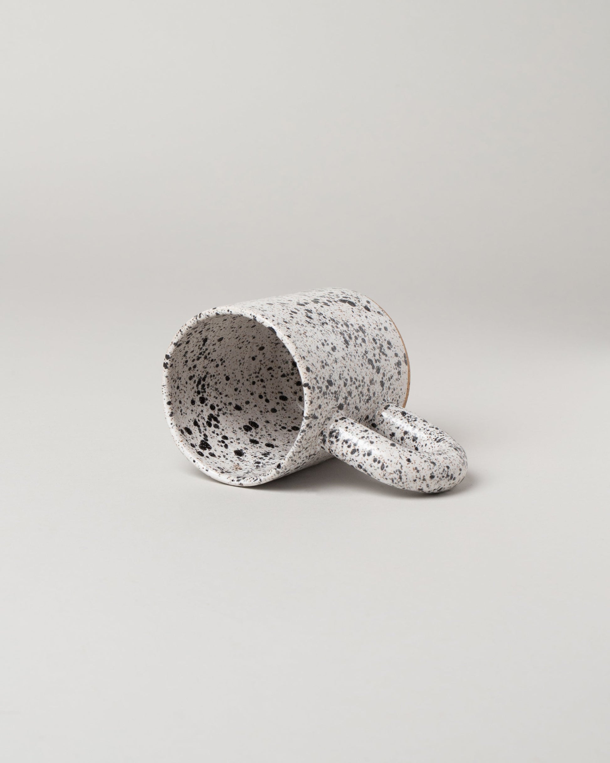 View inside of the Recreation Center Speckled Simple Mug on light color background.