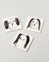 Eleonor Boström Dog Face Coasters on light color background.