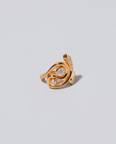 View from the side of the Twist It Ring on light color background.
