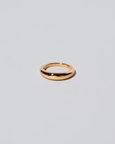 Gold 4.5mm Venus Band on light color background.