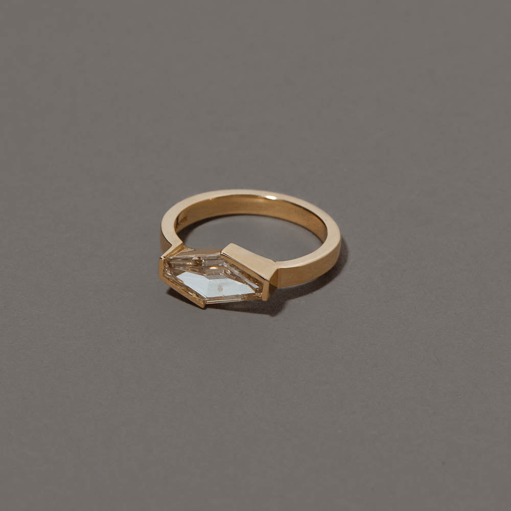product_details::Closeup details of the Mirth Ring on grey color background.