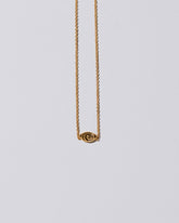 product_hover::Closeup detail of the Gold Altered State Necklace on light color background.