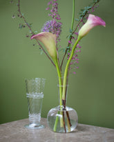Styled image featuring the Bollenglass Design Clear Small Spiral Vase and Clear Bud Vases.