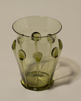 Closeup details of the Bollenglass Design Green Drip Vase on light color background.