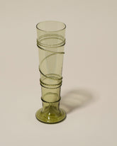 Closeup details of the Bollenglass Design Green Small Spiral Vase on light color background.