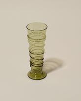 Closeup details of the Bollenglass Design Green Petite Spiral Tumbler on light color background.