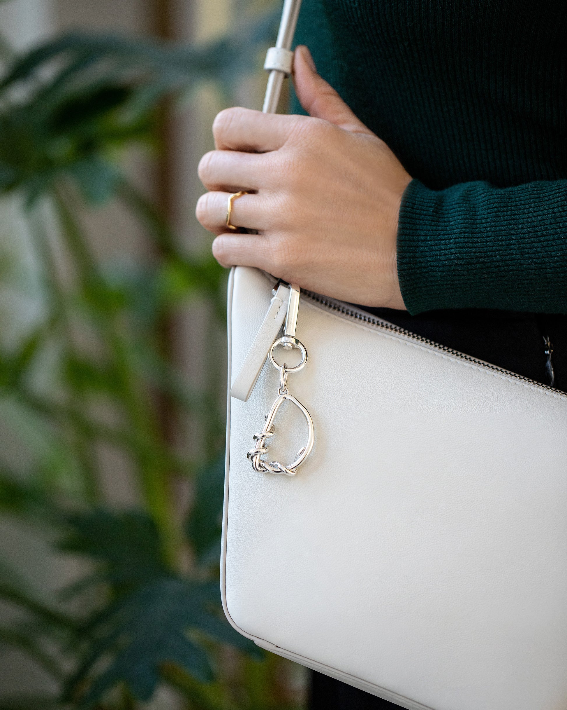 CRZM Sterling Silver Letter D Bag Charm on model.