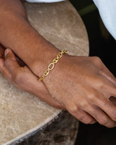 CRZM Gold Solid Gold Yuba Mini Bracelet on male model.