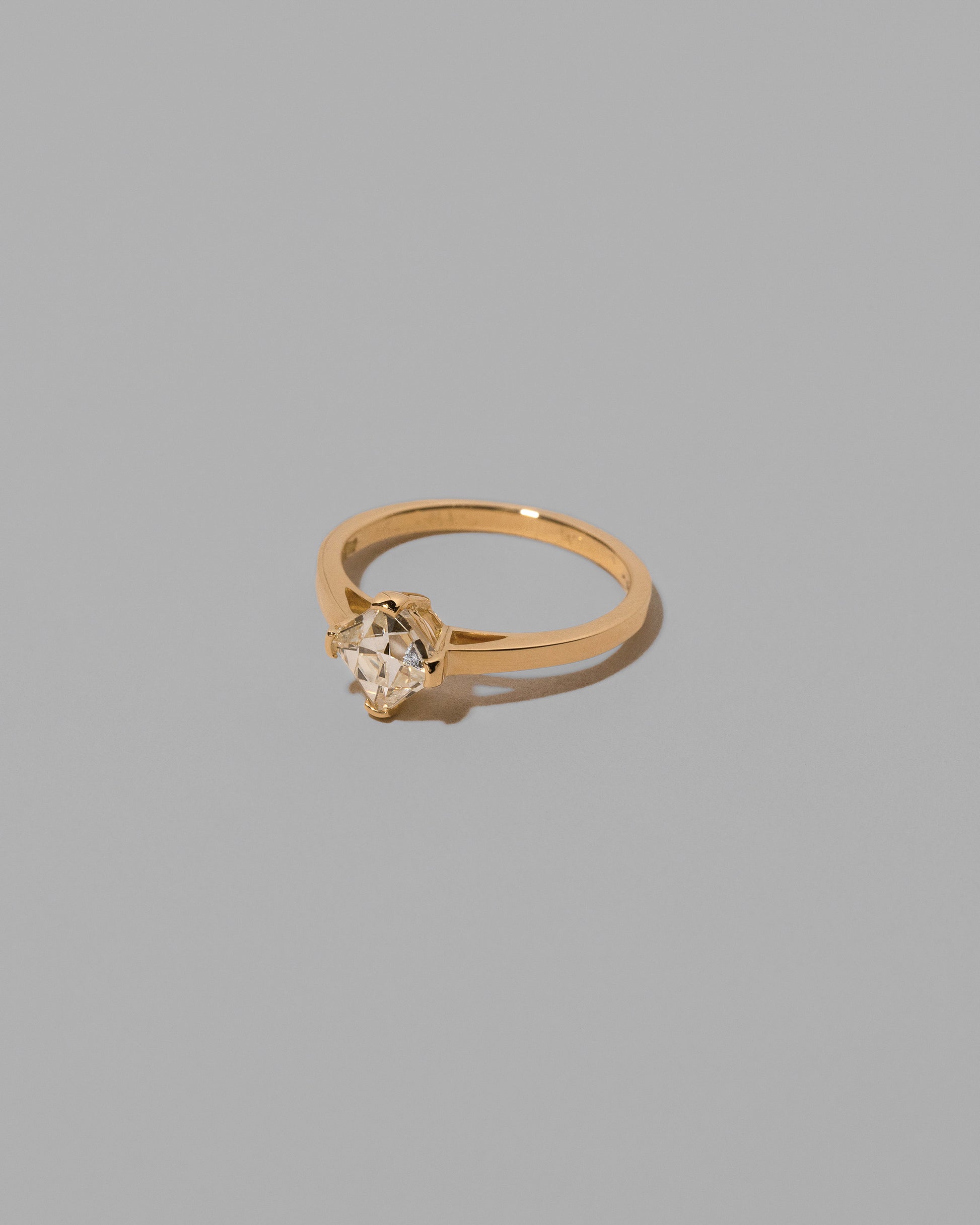 View from the side of the Delight Ring on light color background.