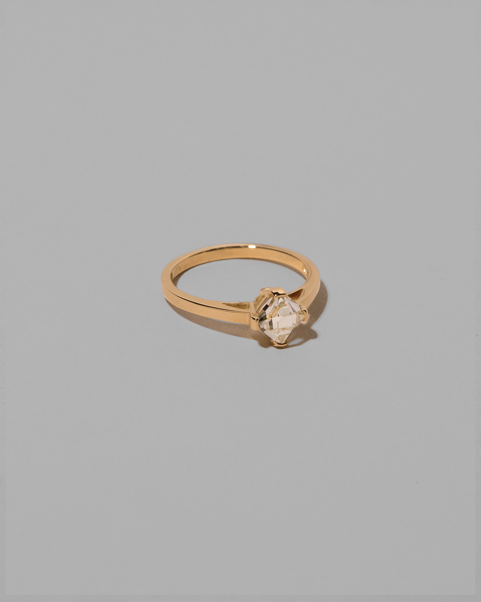 View from the side of the Delight Ring on light color background.