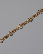 Closeup details of the Envelop Bracelet on grey color background.