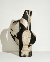 View from the side of the Emily Mullin Dripping Pitcher on light color background.