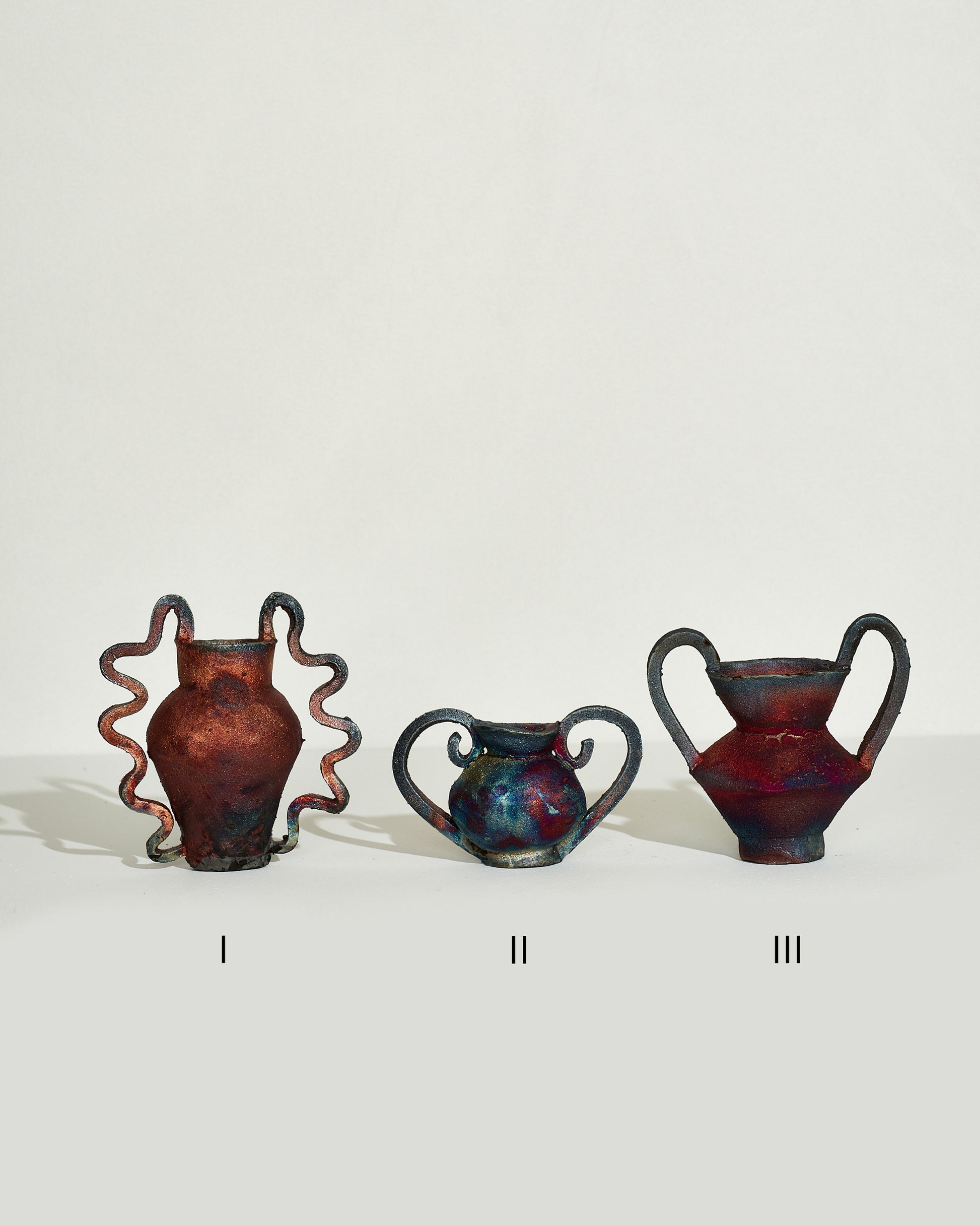 Emily Mullin I Mini Vessel, Emily Mullin II Mini Vessel and Emily Mullin III Mini Vessel from left to right on light color background.