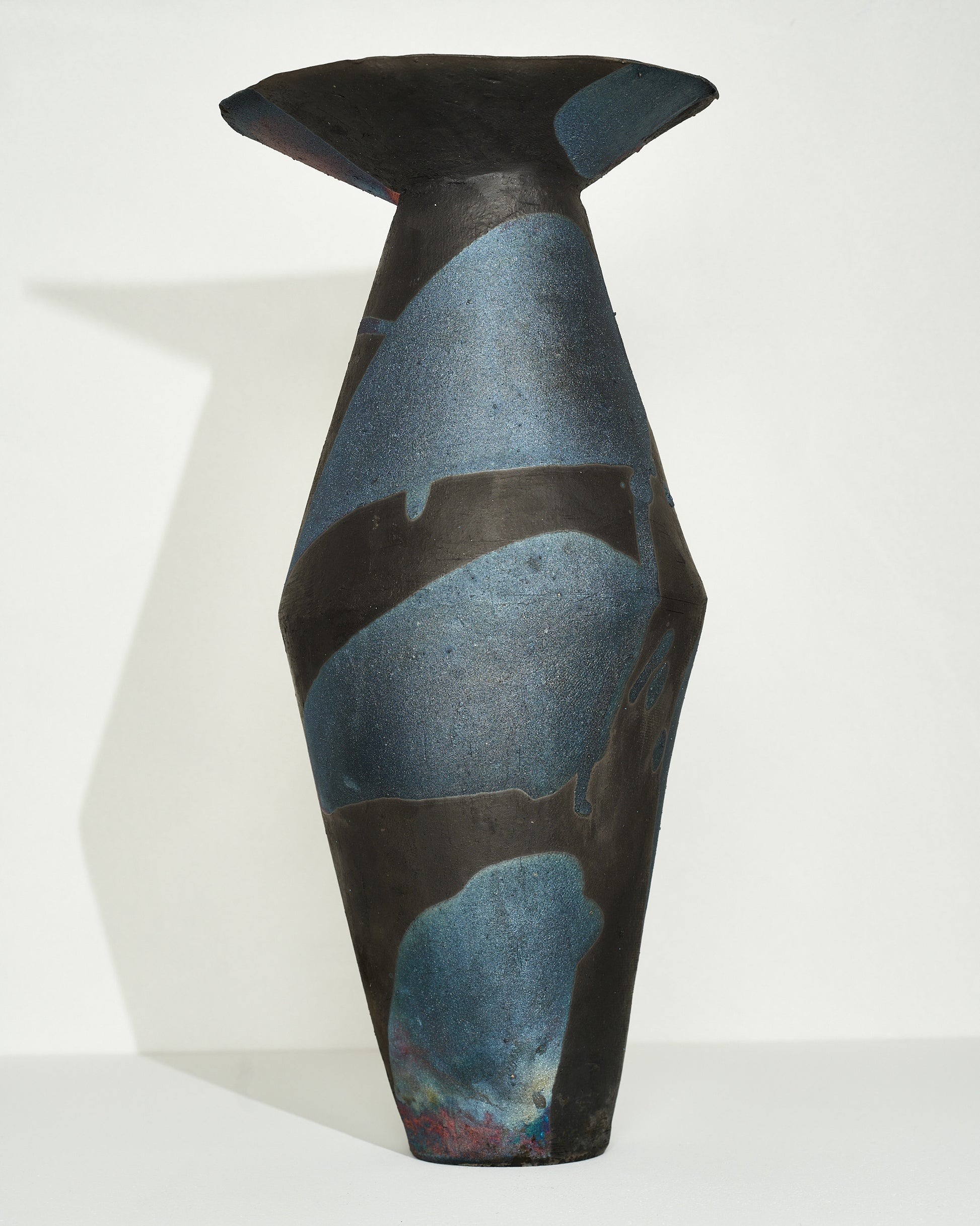 Emily Mullin Indigo Raku Vessel III on light color background.
