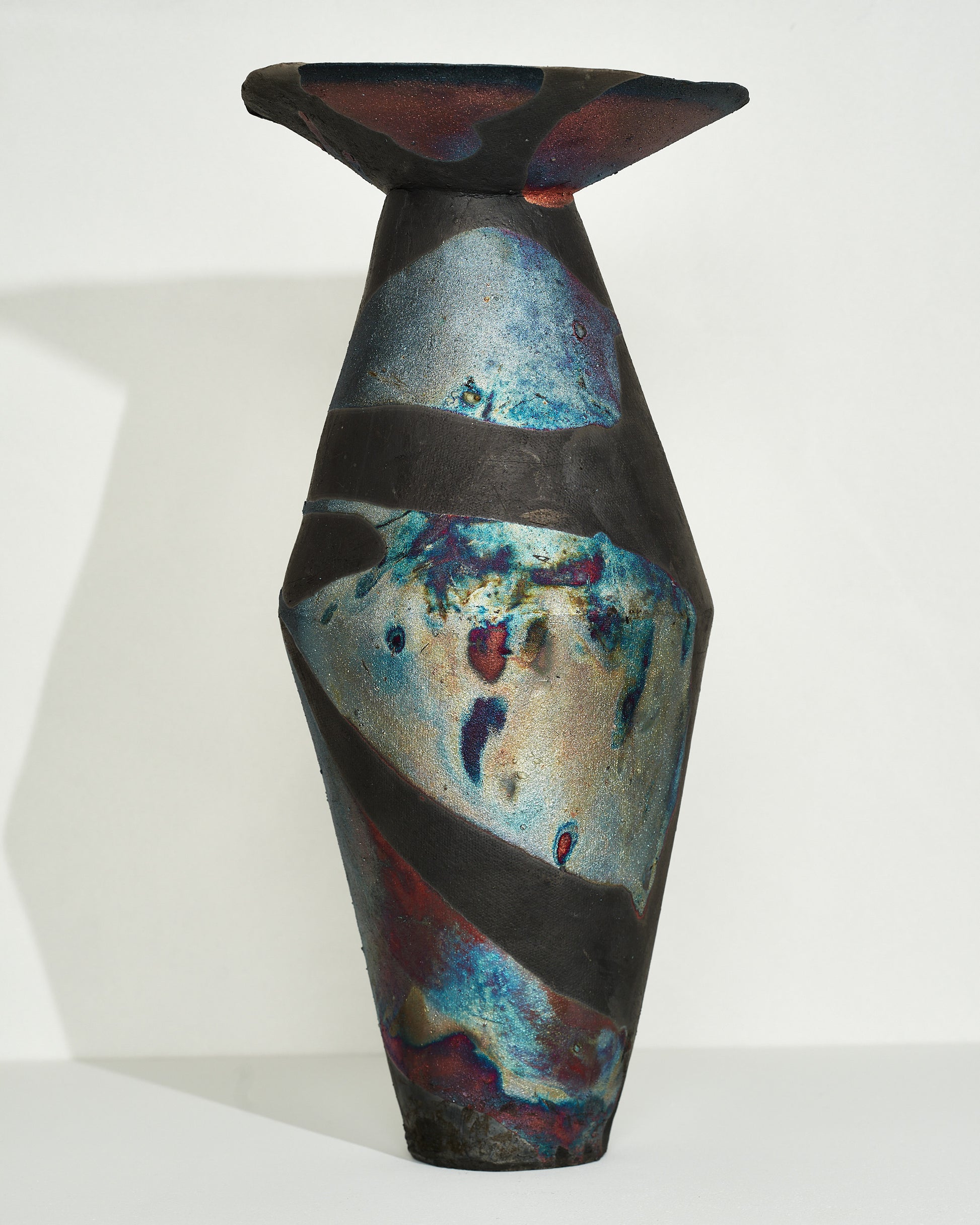 Emily Mullin Indigo Raku Vessel III on light color background.
