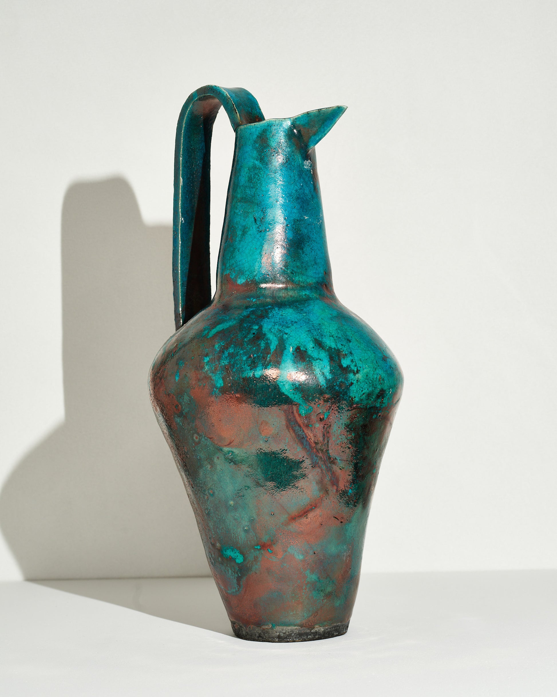 Emily Mullin Raku Pitcher I on light color background.