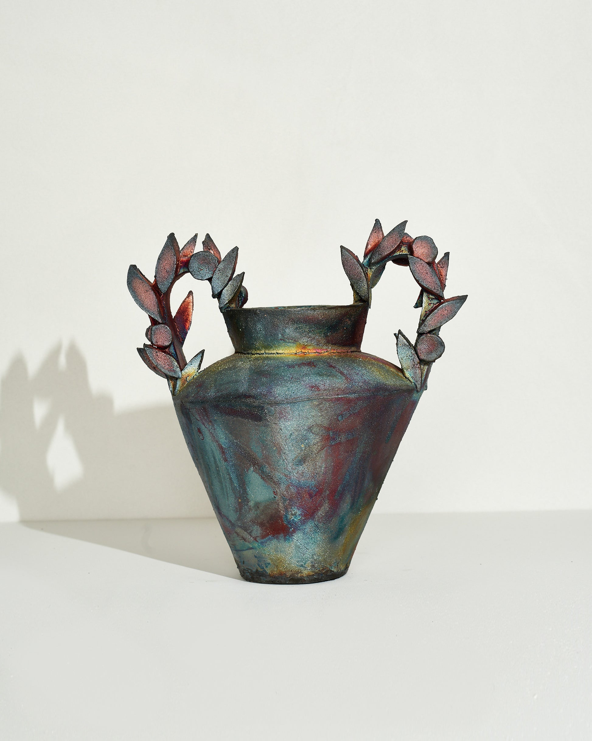 Emily Mullin Roman Garden Vessel on light color background.