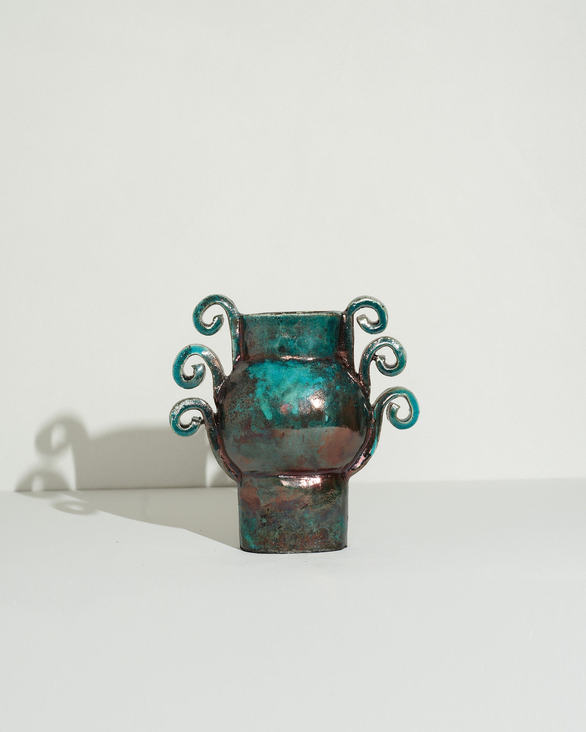 Emily Mullin Turquoise and Copper Vessel II on light color background.