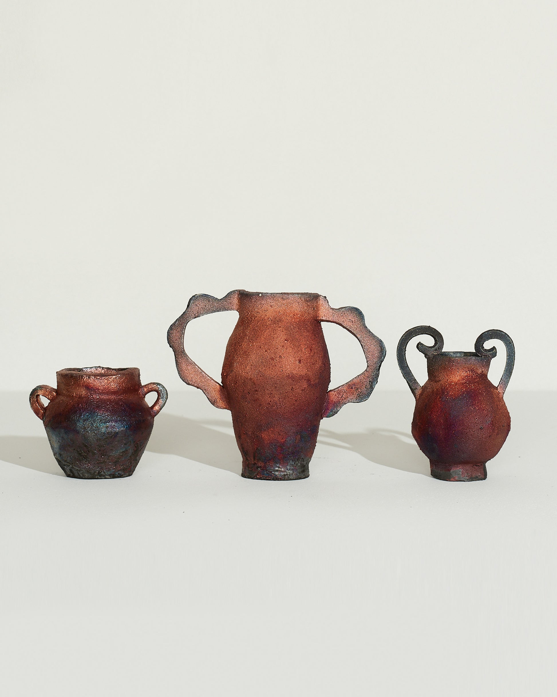 Emily Mullin VII Mini Vessel, Emily Mullin VIII Mini Vessel and Emily Mullin IX Mini Vessel from left to right on light color background.