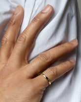 Gold 2.5mm Etched Lines Band on model.