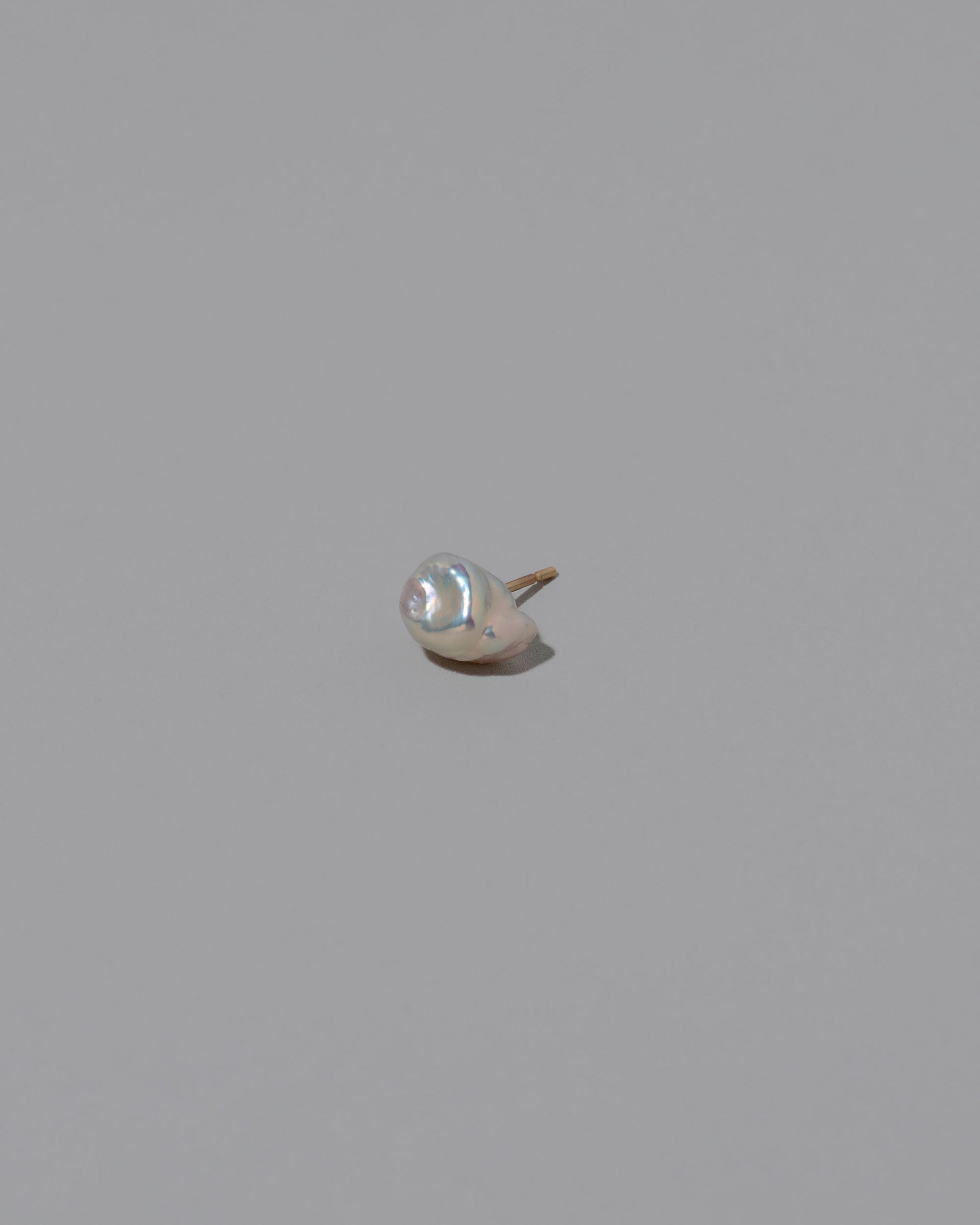 Natural Lagniappe Pearl Stud Earring Single on light color background.