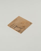 View from the back of the Pearce Objects Cast Bronze Floppy Disk on light color background.