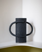 Giselle Hicks Large Coal Black Oval Vessel with Handles on light color background.