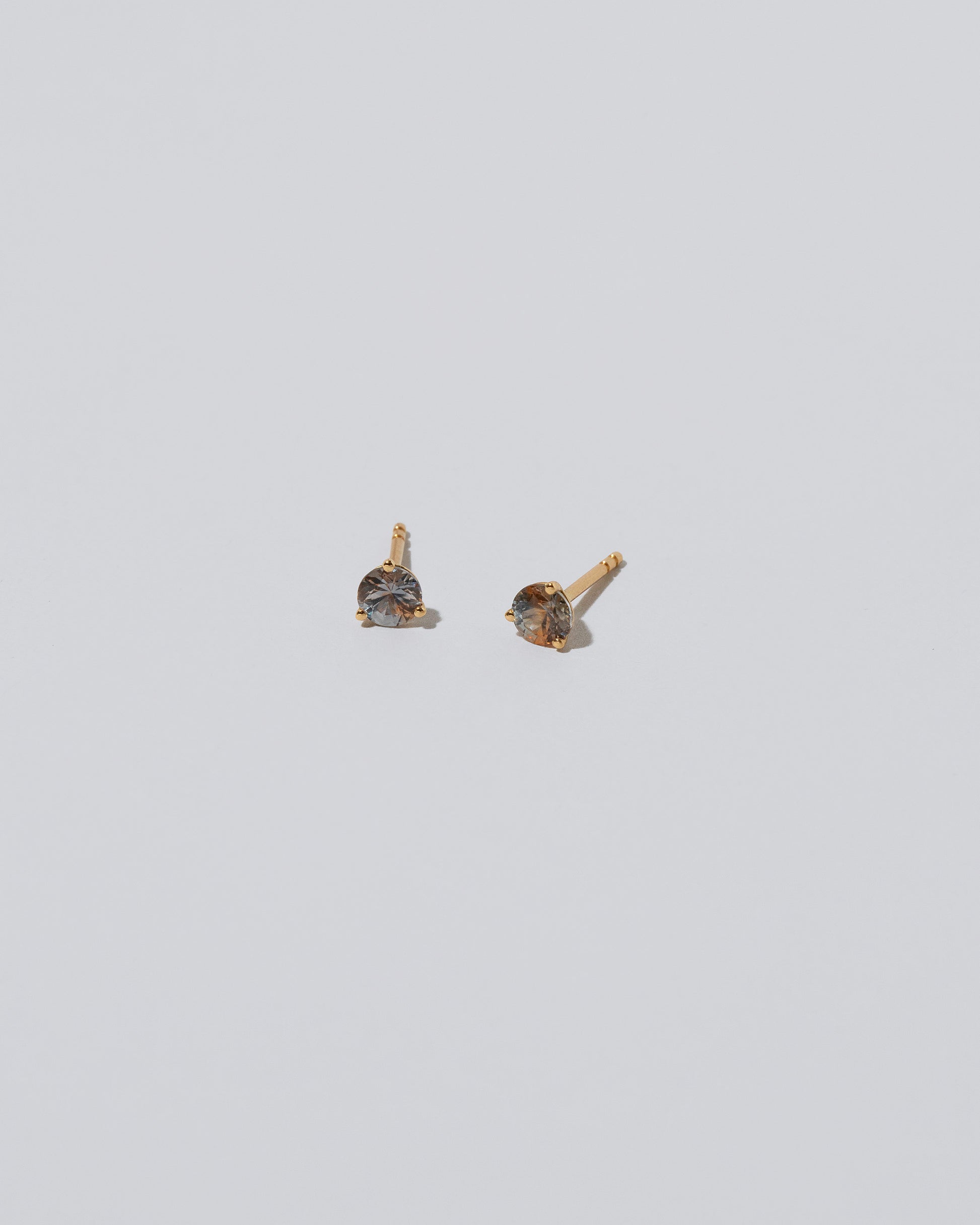 Martini Stud Earring - Orange/Purple Sapphire on light color background.