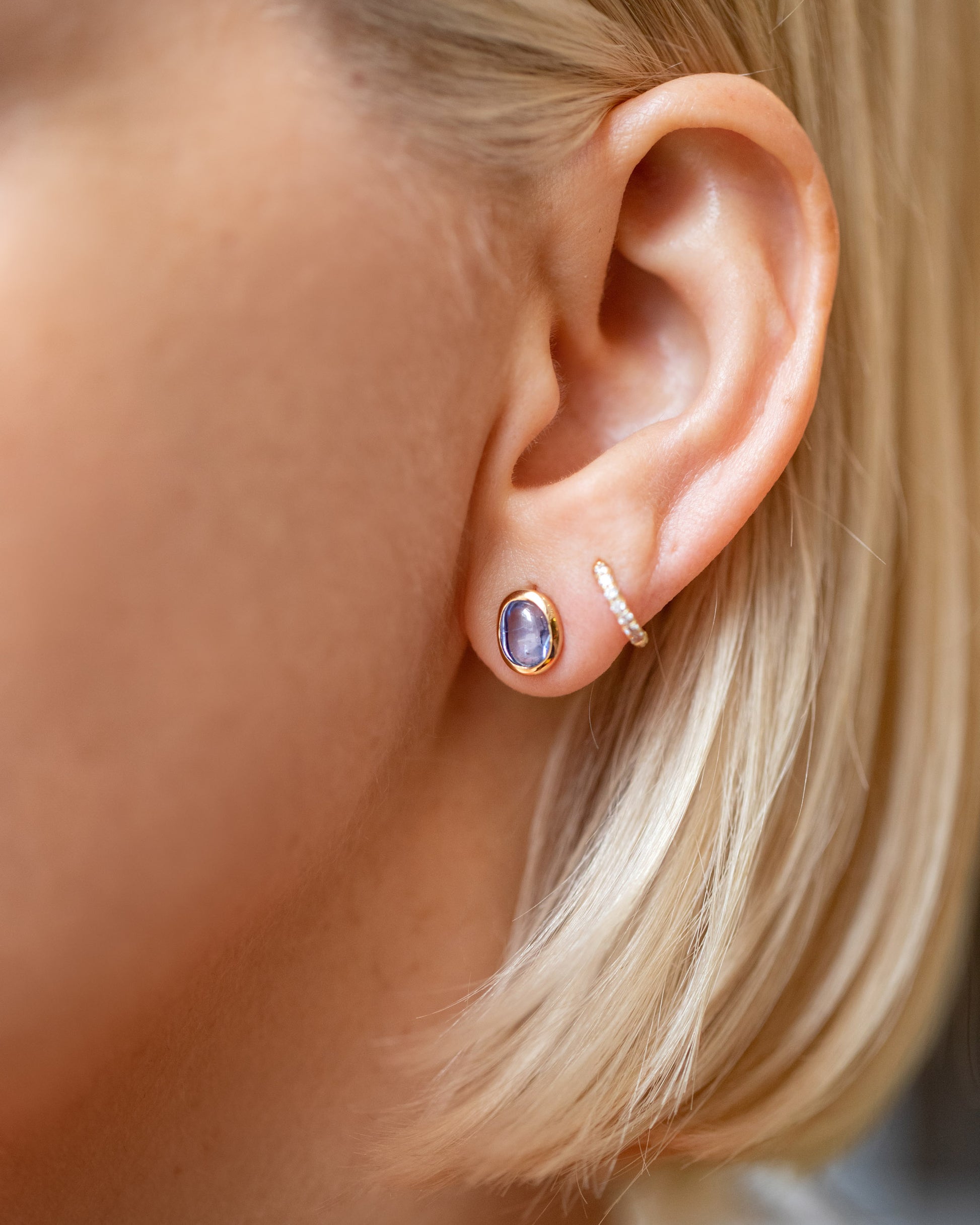Gusher Blue Sapphire Stud Earrings 002 on model.