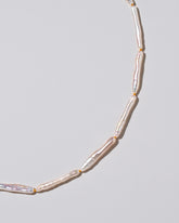 Stick Pearl Strand Necklace on light color background.