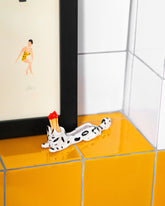 Styled image featuring the Eleonor Boström Black Spots Matchstick Cat.