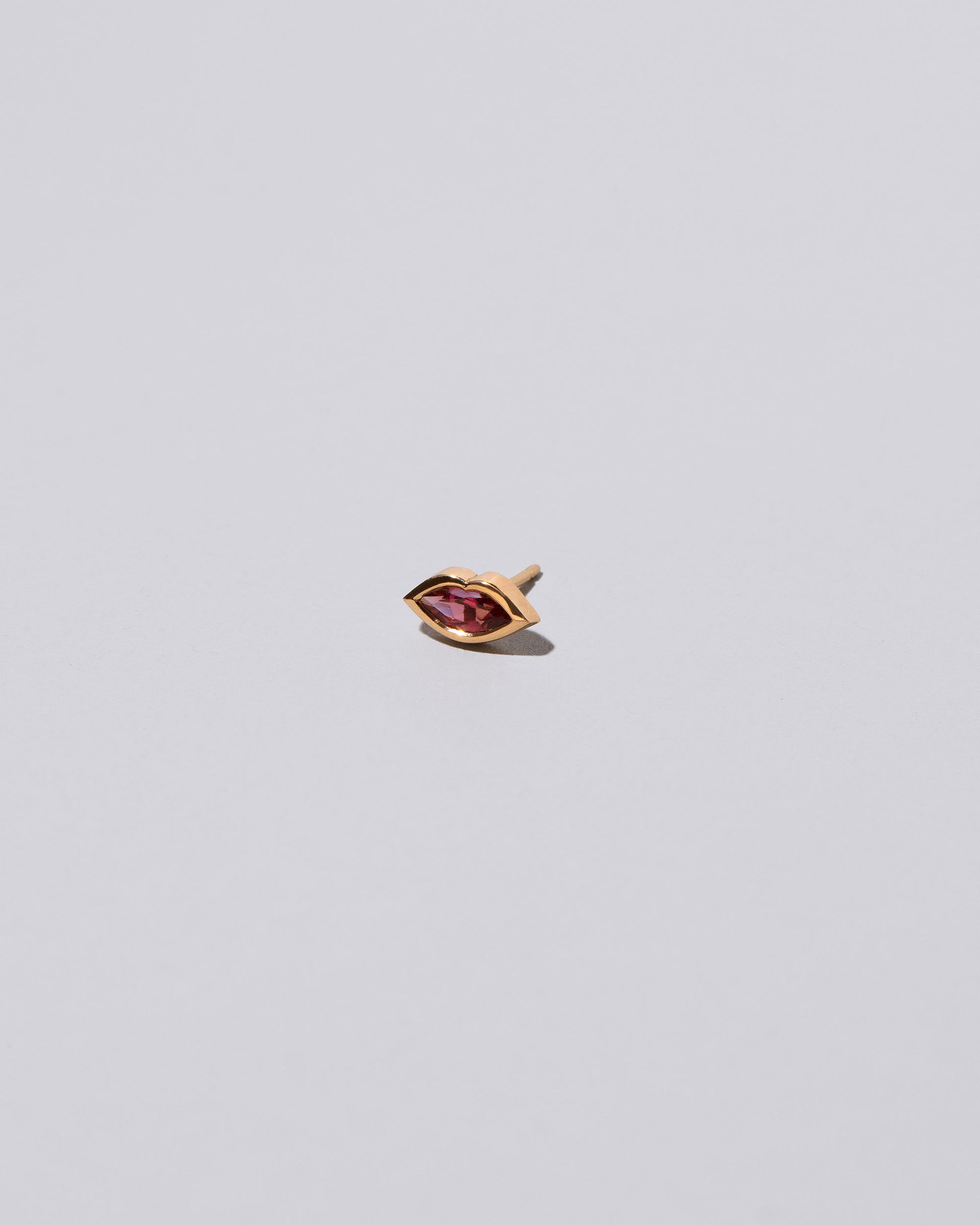 Big Kiss Stud Earring Single on light color background.