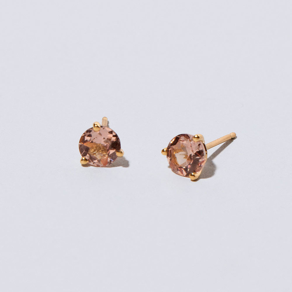 product_details::Mega Lotus Garnet Martini Stud Earrings on light color background.