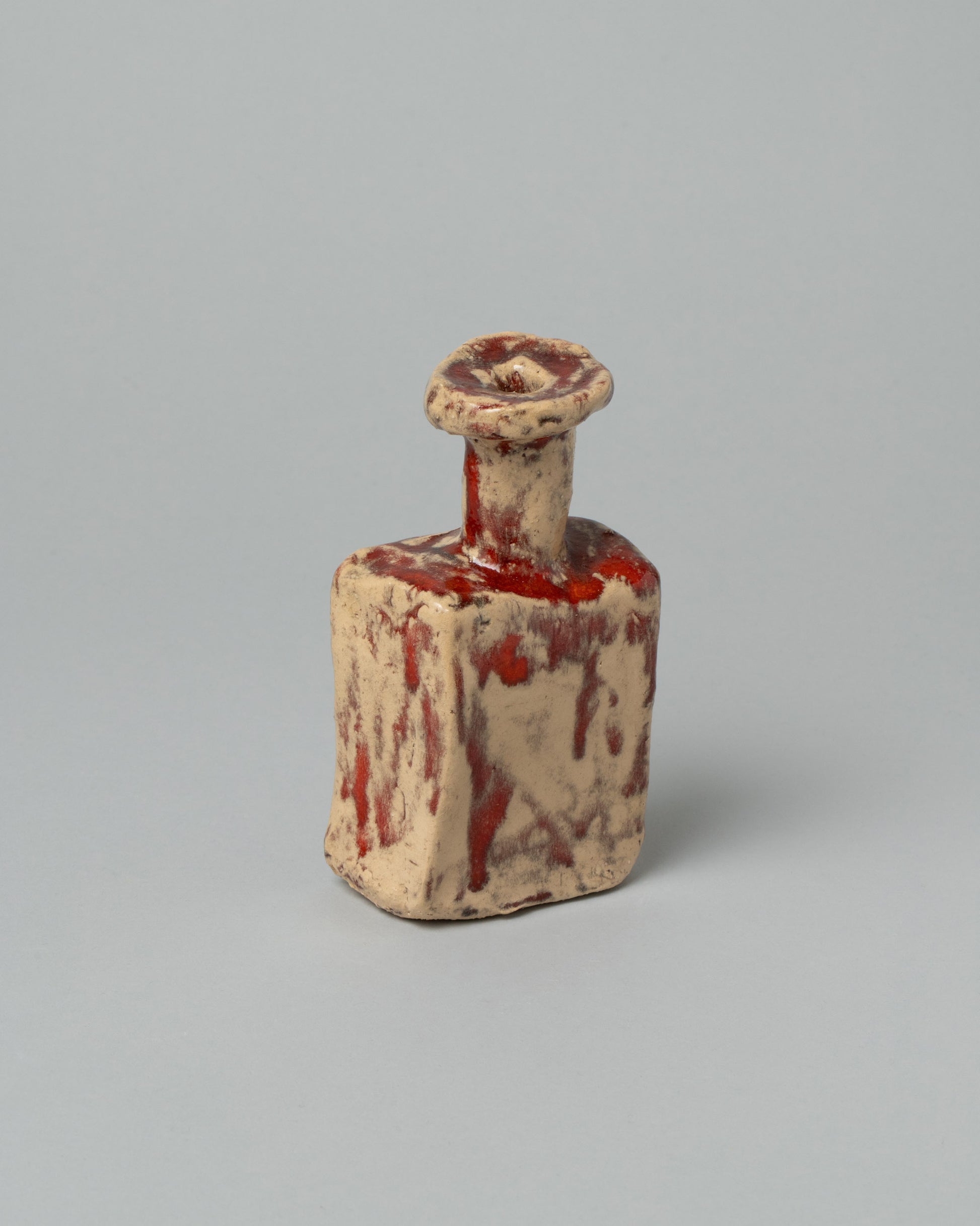 Closeup details of the Willem van Hooff Cream & Red Extra Small Core Sculpture on light color background.