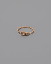 Lotus Garnet Teardrop Ring on light color background.
