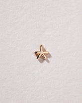 Star Stud Earring Single on light color background.