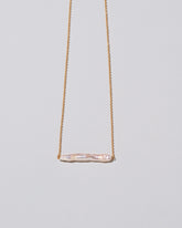 Stick Pearl Necklace on light color background.