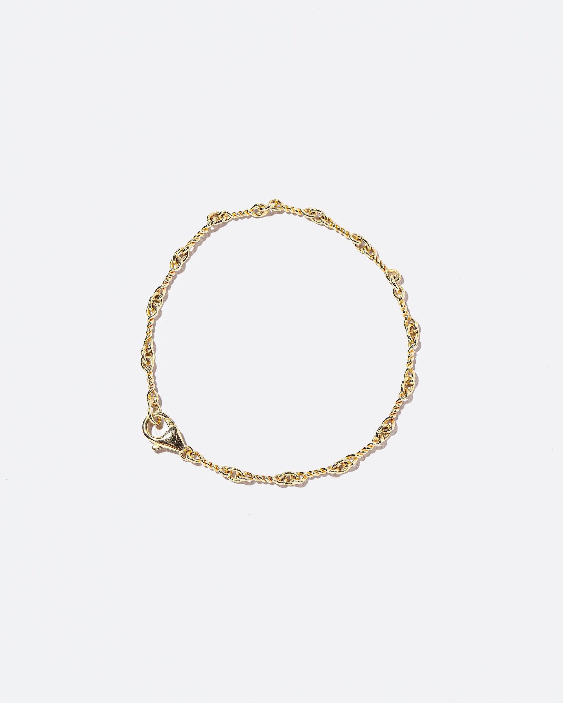 Twisted Chain Bracelet on light color background.