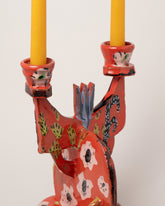 Closeup details of the Maggie Boyd Red Hot Candelabra on light color background.